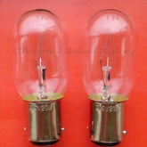 Two miniature lamps 110v 20w Ba15d base indicator bulbs on red background